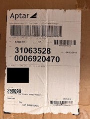 Aptar-38-400 Blue Flip Top Tab Caps with valve. Quantity 1200 per box